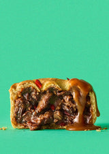 Pieway's El Gaucho steak pie, cut open with a drizzle of thick gravy 
